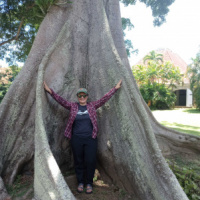 Erika standing in front of a tree